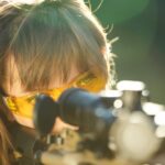 woman wearing safety glasses with rifle 2026 01 05 00 50 21 utc