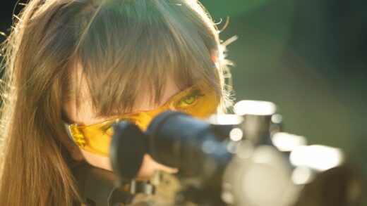 woman wearing safety glasses with rifle 2026 01 05 00 50 21 utc